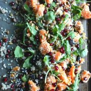 Stay nourished through winter with quinoa, pomegranate, dried cherries, arugula, and pumpkin seeds in apple cider vinaigrette. Fall and Winter Sweet Potato Salad #quinoasalad #pomegranate #thanksgiving #christmas #holidaysalad