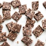 chocolate energy bar squares on parchment paper