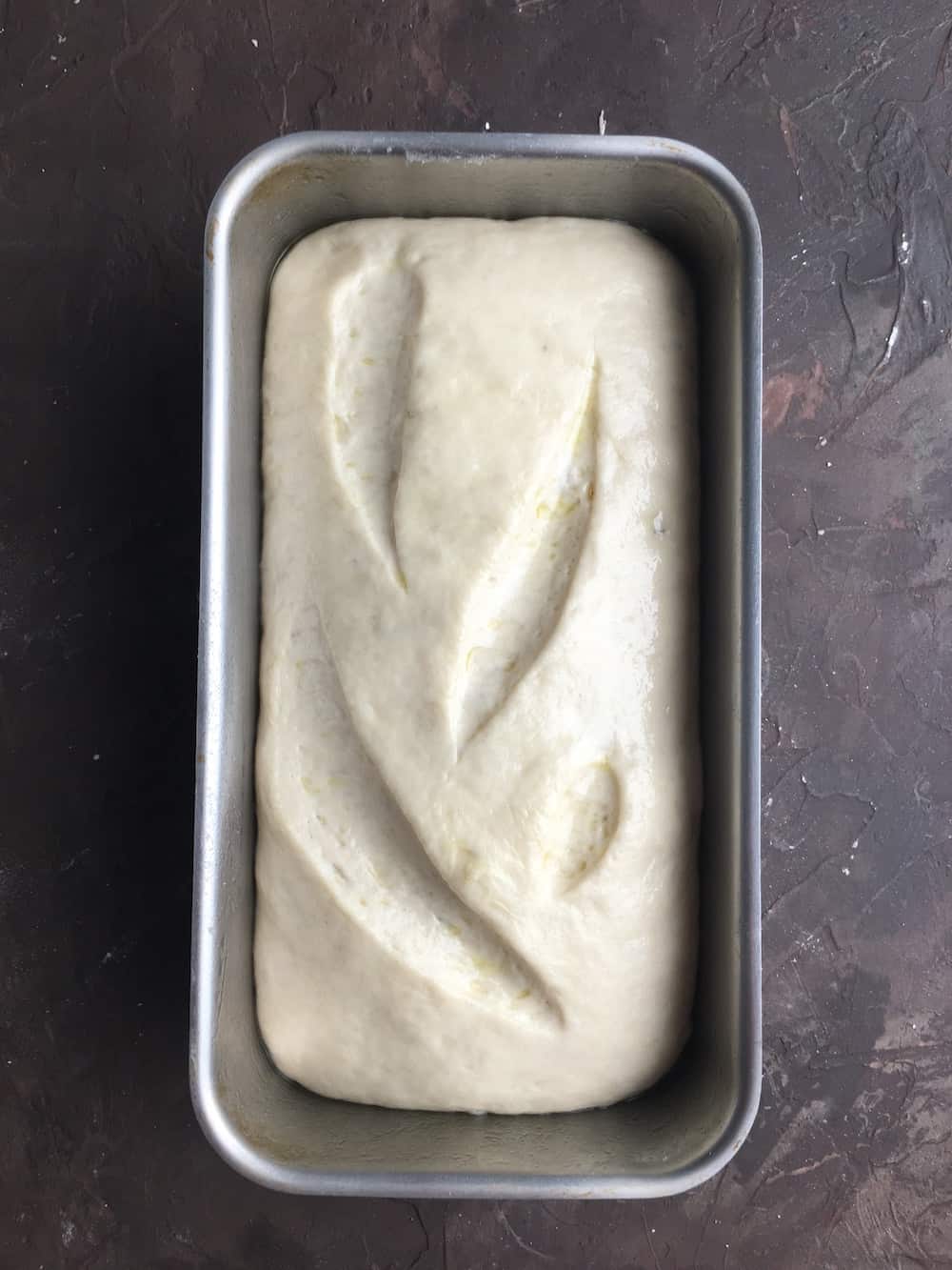 unbaked french bread in loaf pan