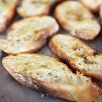 Make crostini with a baguette, rustic loaf, or ciabatta for the perfect bruschetta or dipping tool. You only need olive oil and bread #crostini #partyfood #bruschetta #toastpoints #appetizers #partyfood #horsdoeuvres