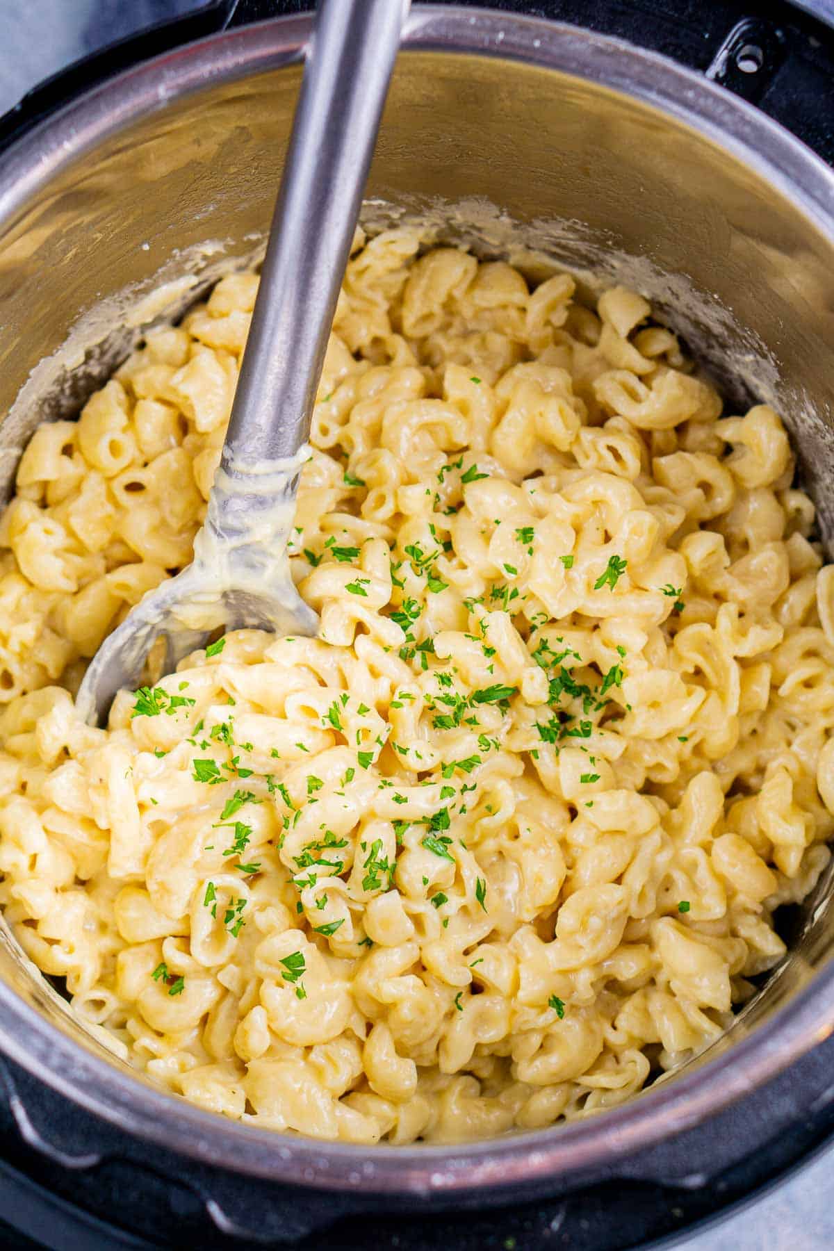 mac and cheese in Instant Pot with spoon