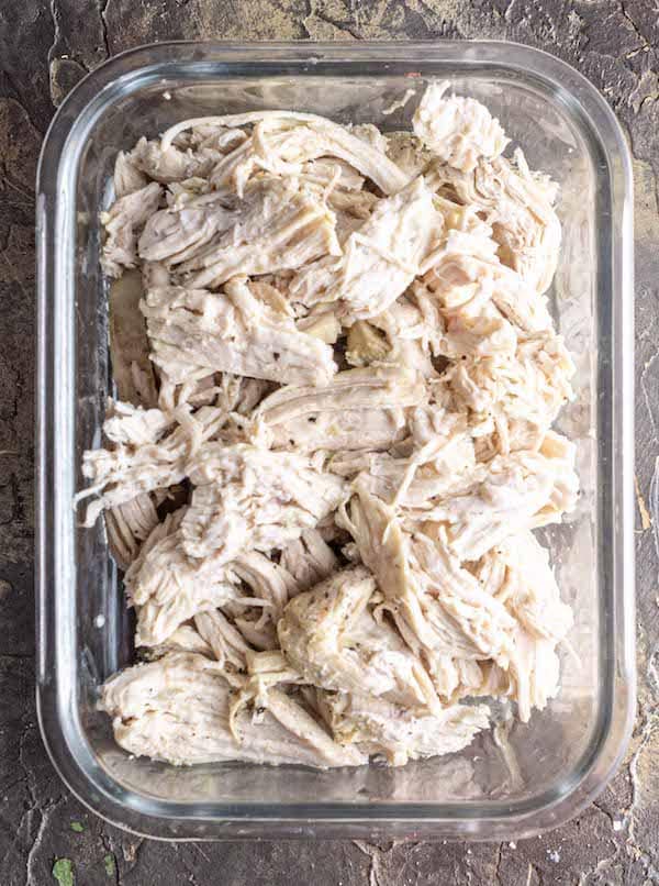 Shredded chicken breast in glass meal prep container