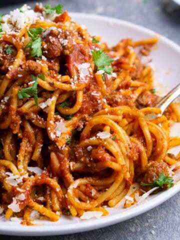 instant pot spaghetti on white plate with fork