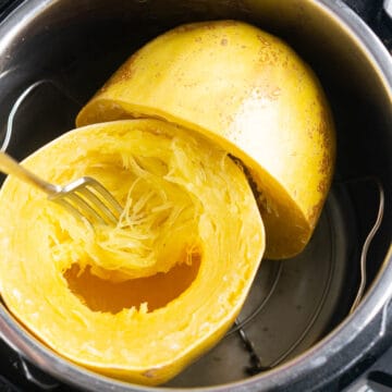 a dinner fork tests pressure cooked spaghetti squash noodles for tenderness