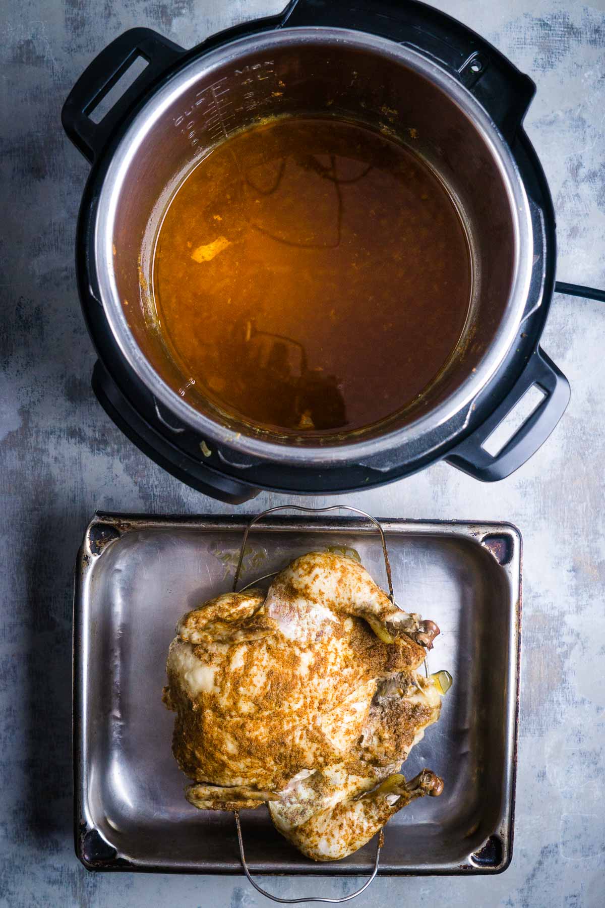 chicken drippings in Instant Pot next to whole chicken in pan