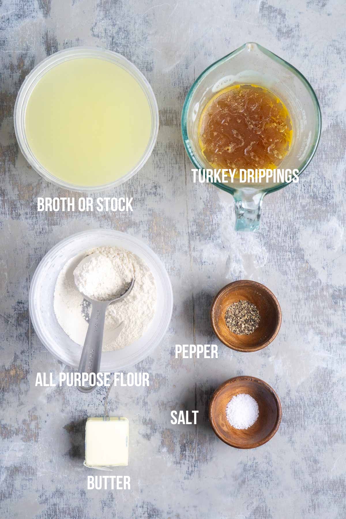 top down view of turkey gravy ingredients in various sized bowls labeled with text overlay