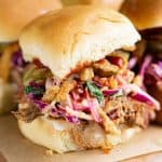bbq pork sliders with coleslaw, French fried onions, pickles, and bbq sauce