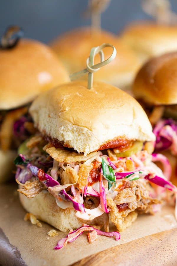 bbq pork sliders with coleslaw, French fried onions, pickles, and bbq sauce