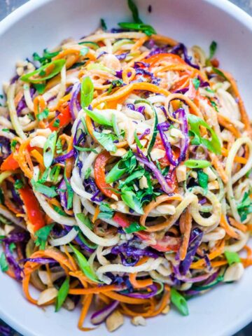 Thai peanut zoodles entree in white bowl