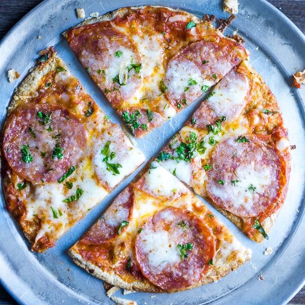 sliced pepperoni tortilla pizza on serving pan