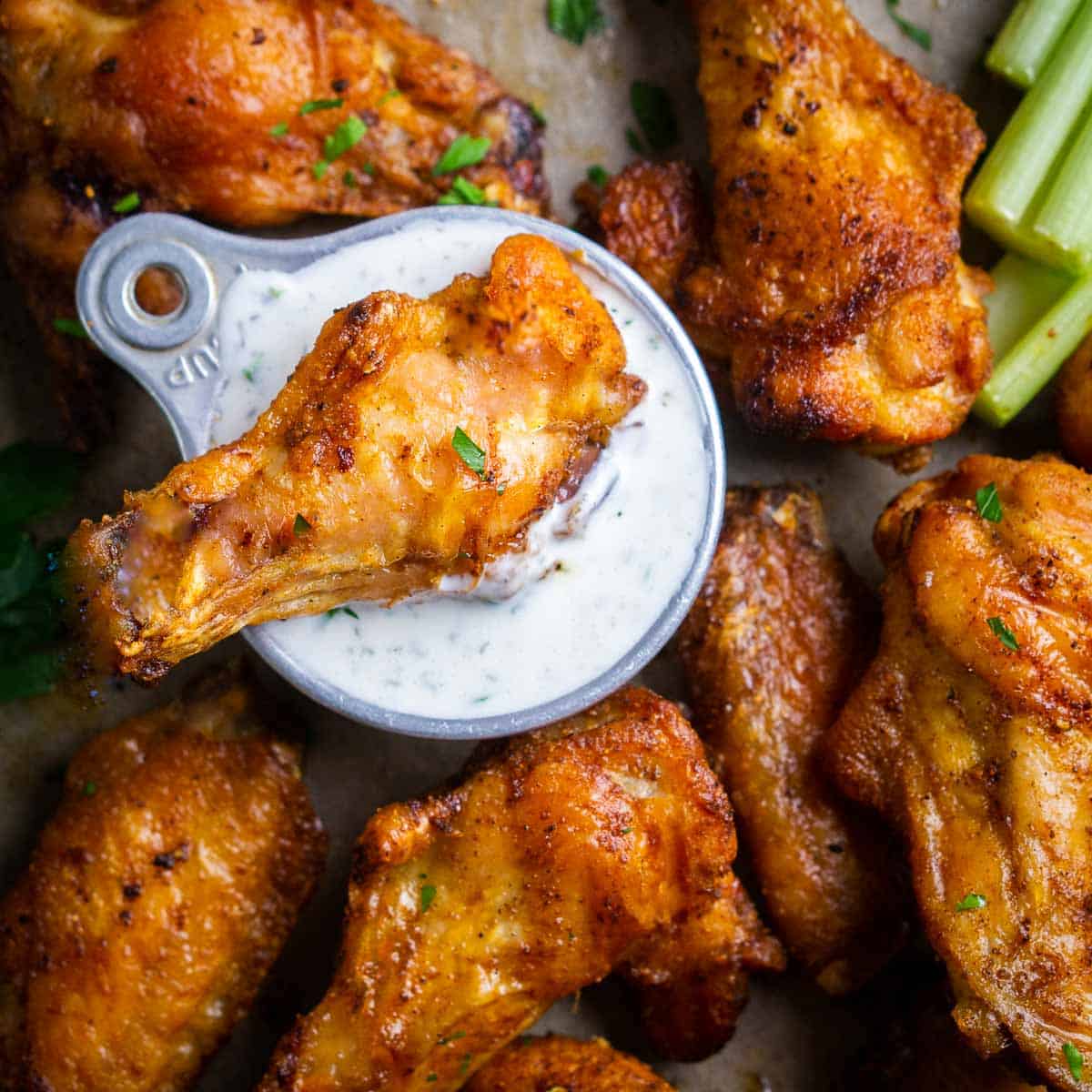 crispy baked chicken wings with ranch dressing and celery sticks