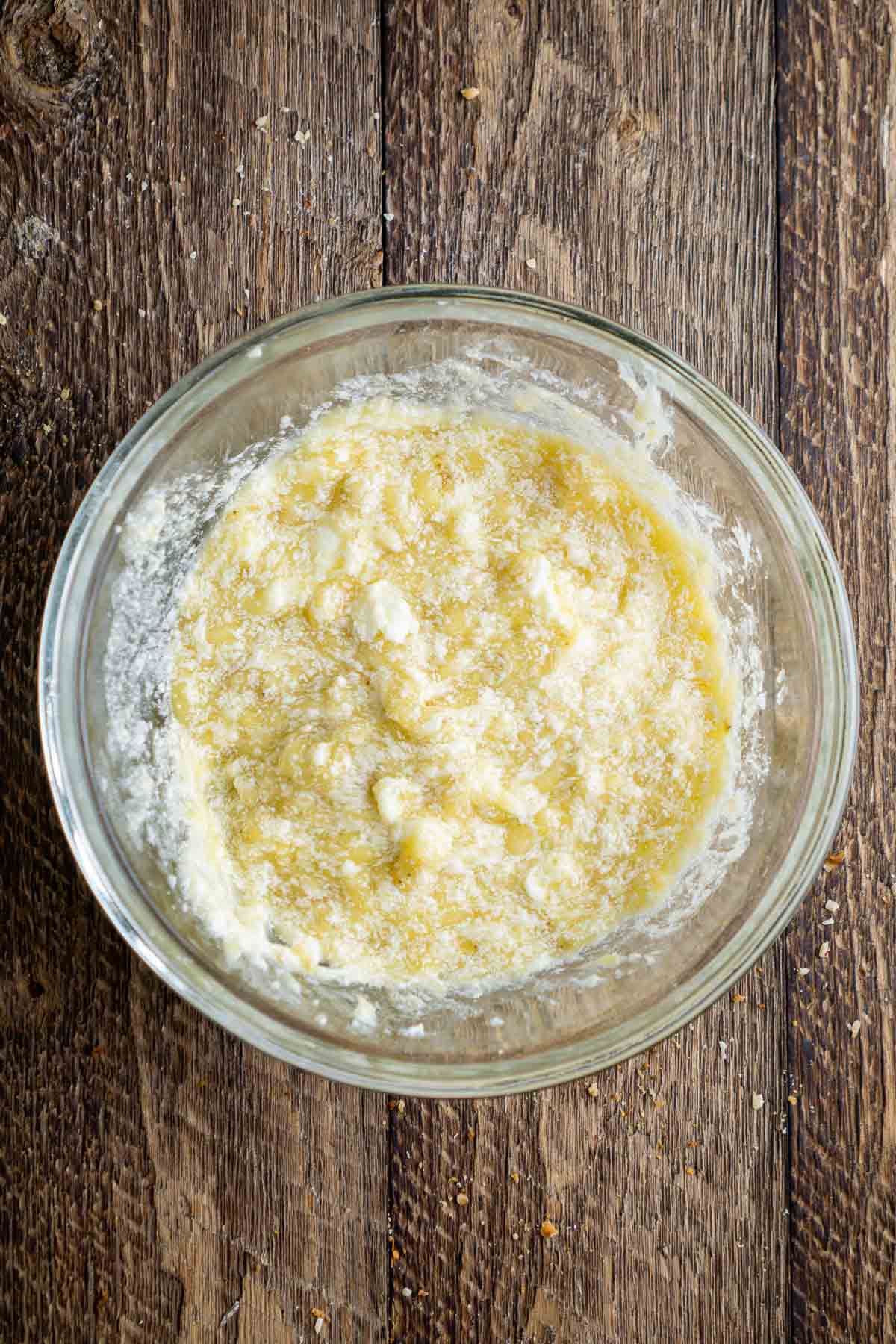 Mashed banana mixture in a glass bowl.