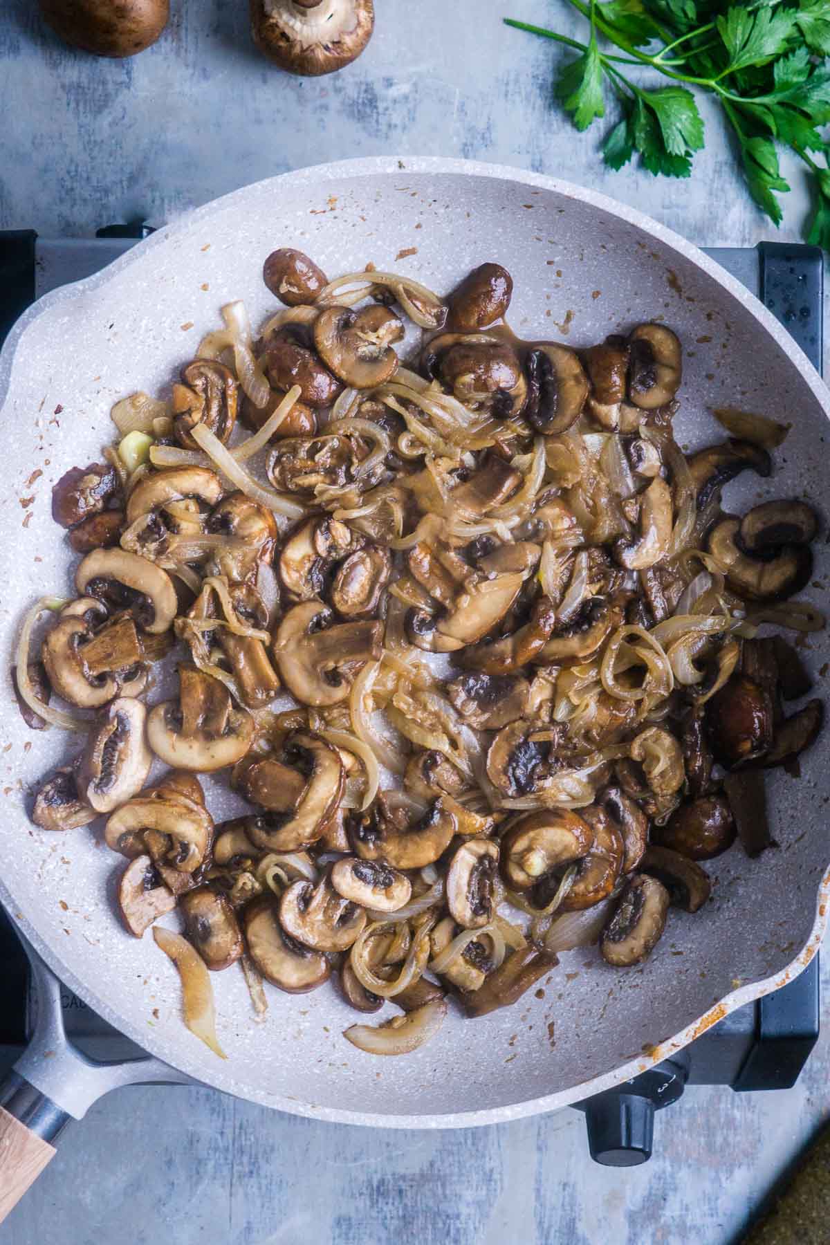 sauteed mushrooms and onions in large skillet