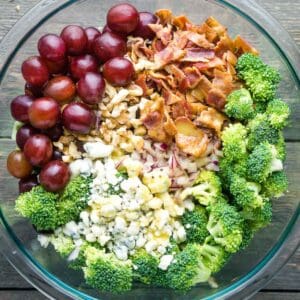 broccoli grape salad in glass mixing bowl