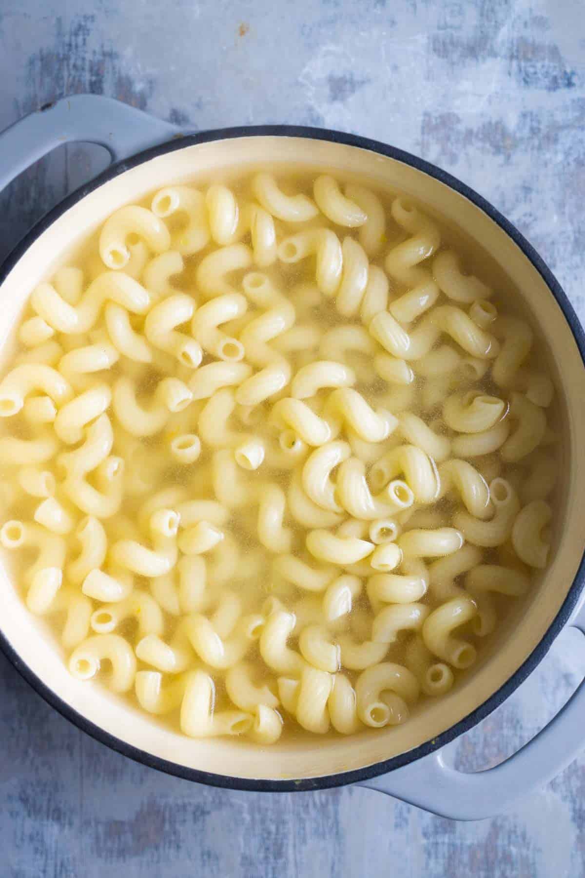 pasta cooks in water in saucepan