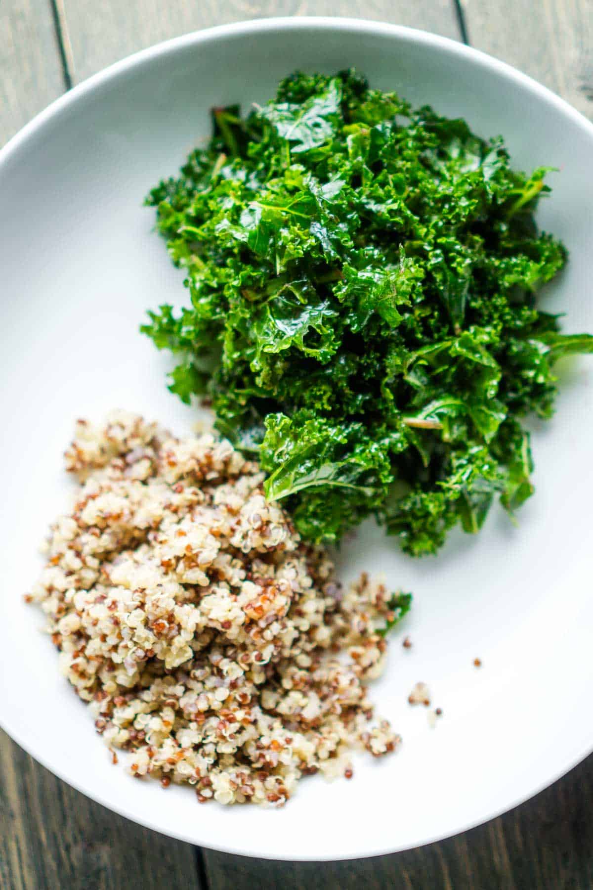 kale and quinoa in white bowl