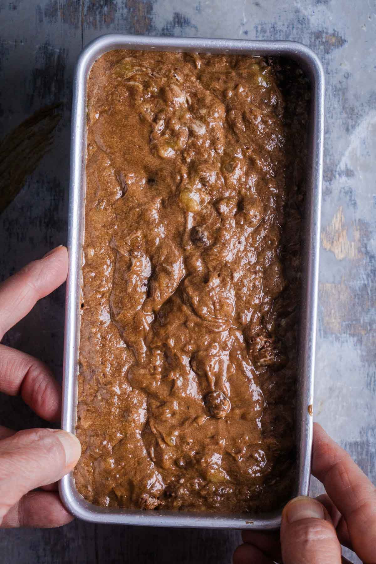 Chocolate banana bread batter in loaf pan