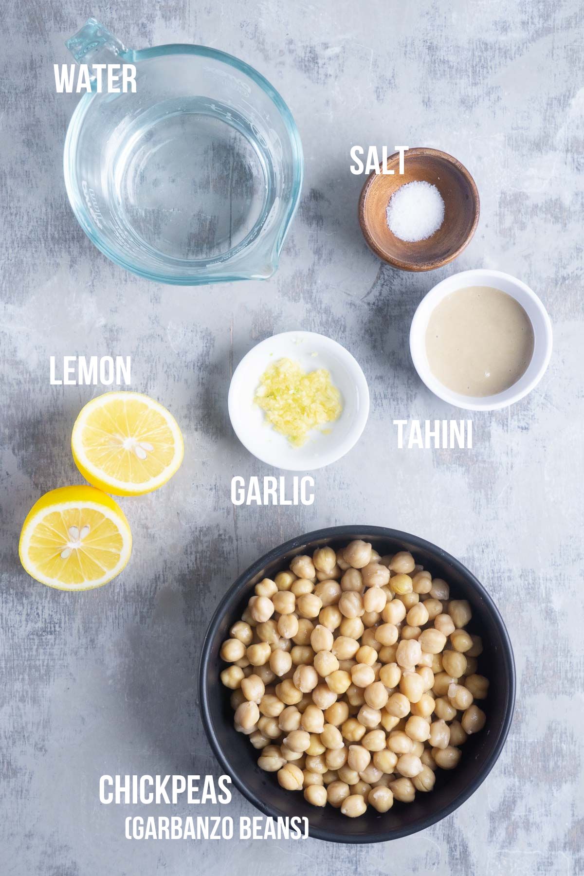 labeled hummus ingredients in bowls