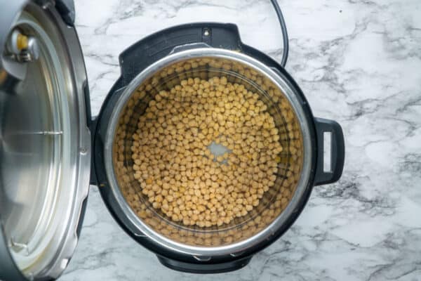 Overhead view of uncooked chickpeas in Instant Pot