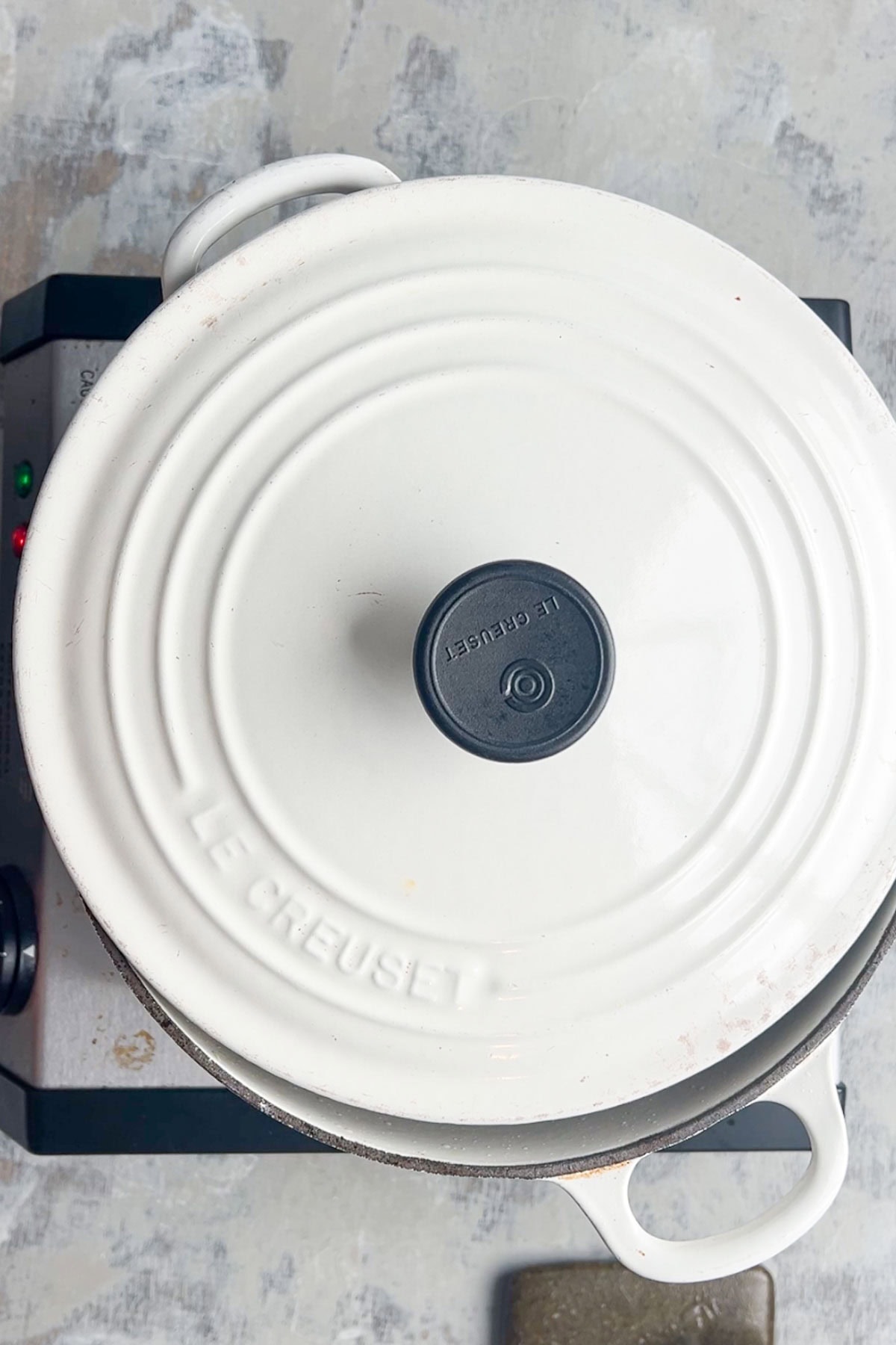 top down view of partially covered Dutch oven