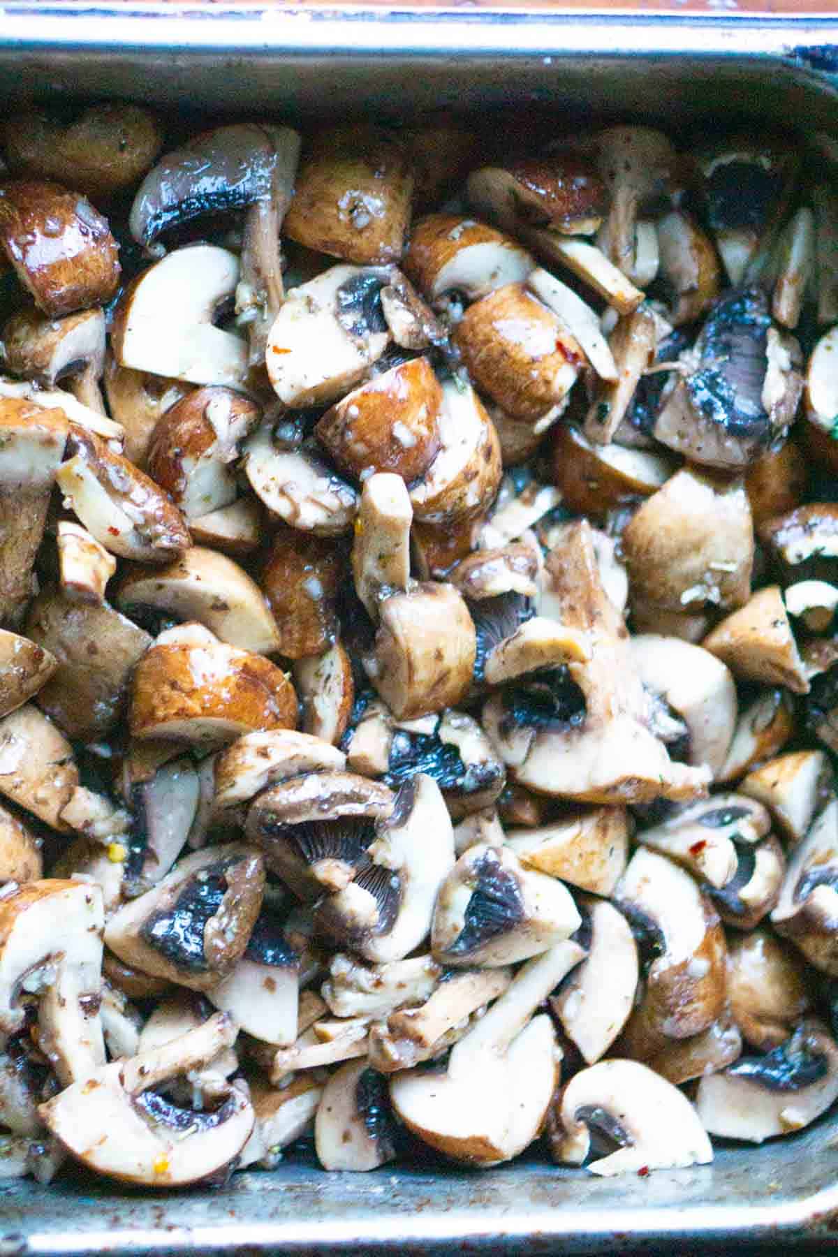 marinated mushrooms in stainless steel pan