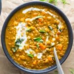 pumpkin curry in bowl with spoon