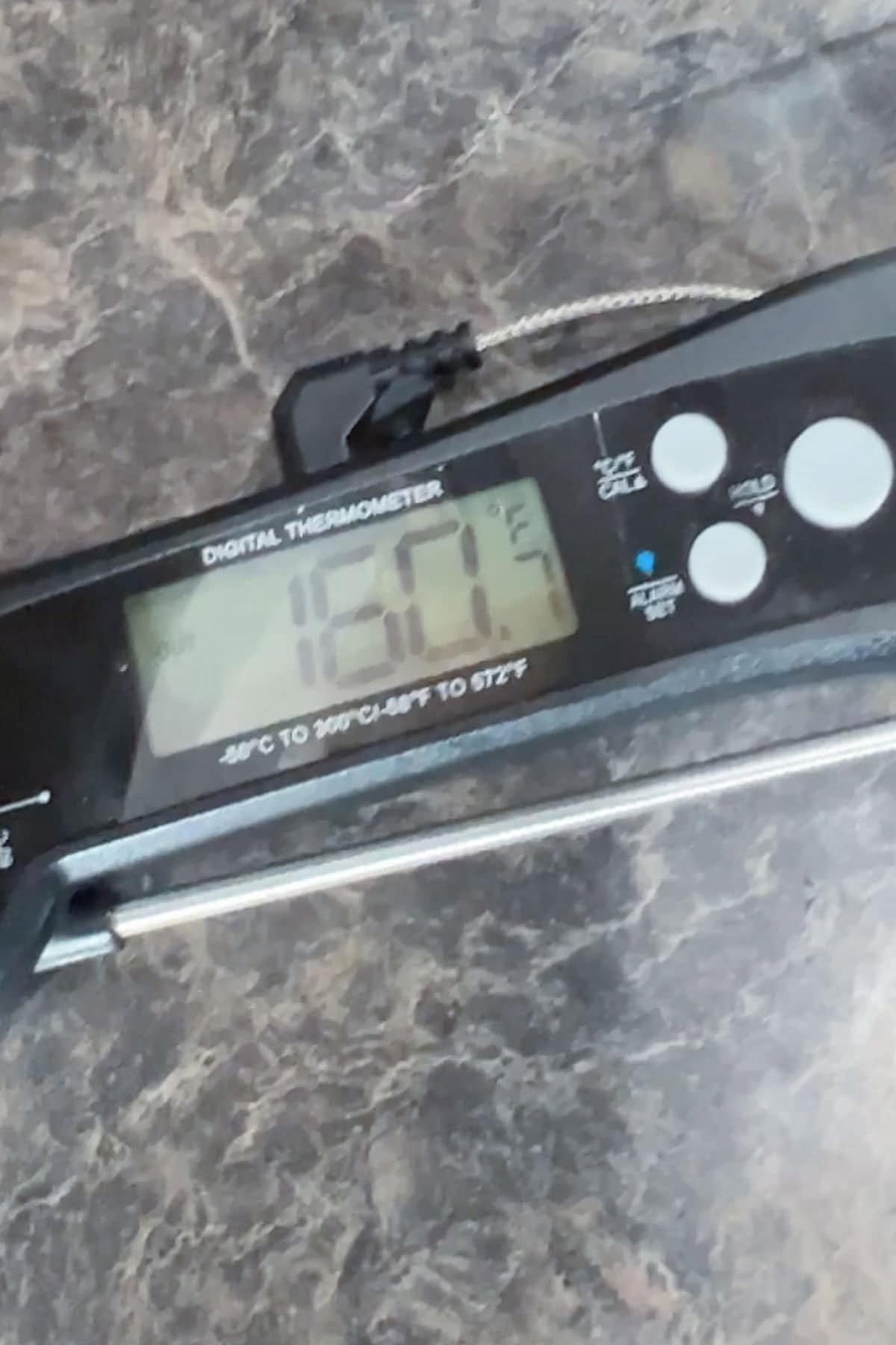 Digital meat thermometer displaying a temperature of 160.7 degrees Fahrenheit.