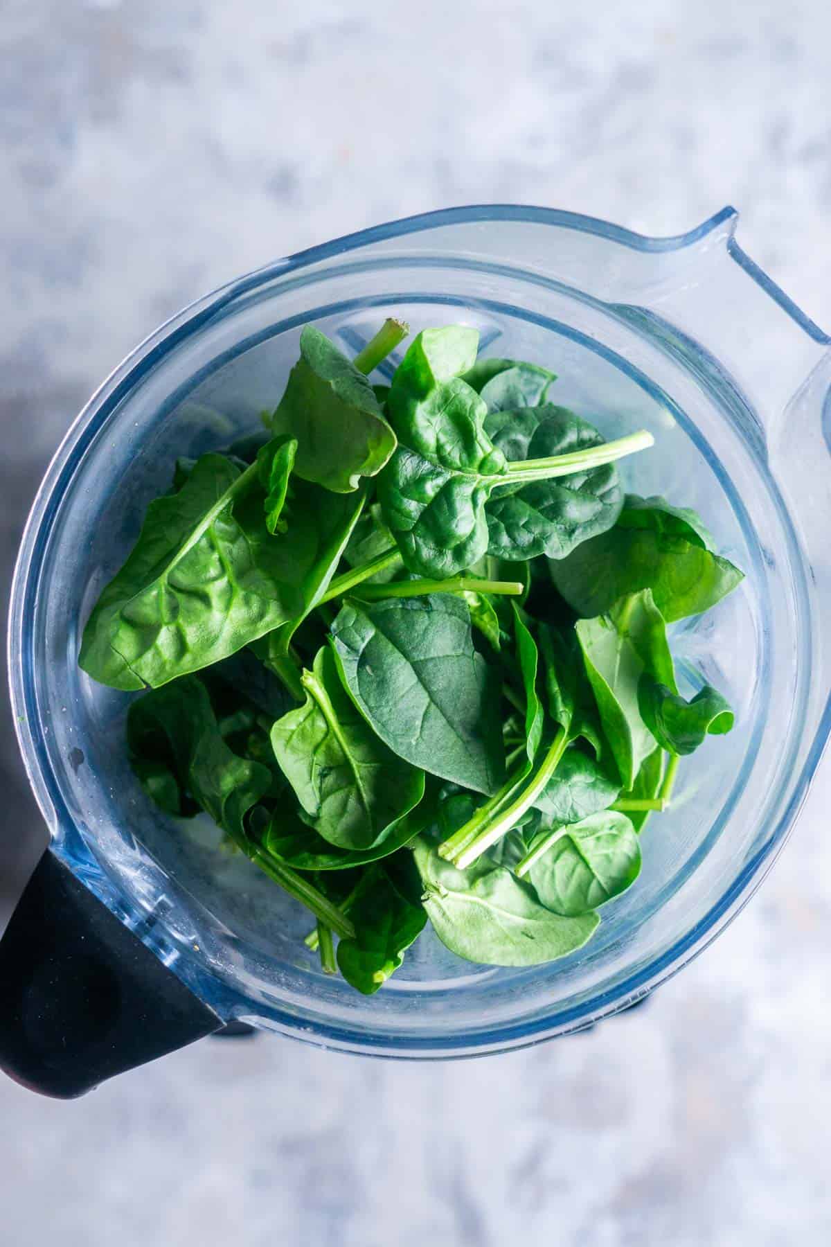 fresh spinach leaves in blender