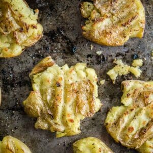 crispy baked smashed potatoes on baking sheet