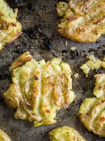crispy baked smashed potatoes on baking sheet