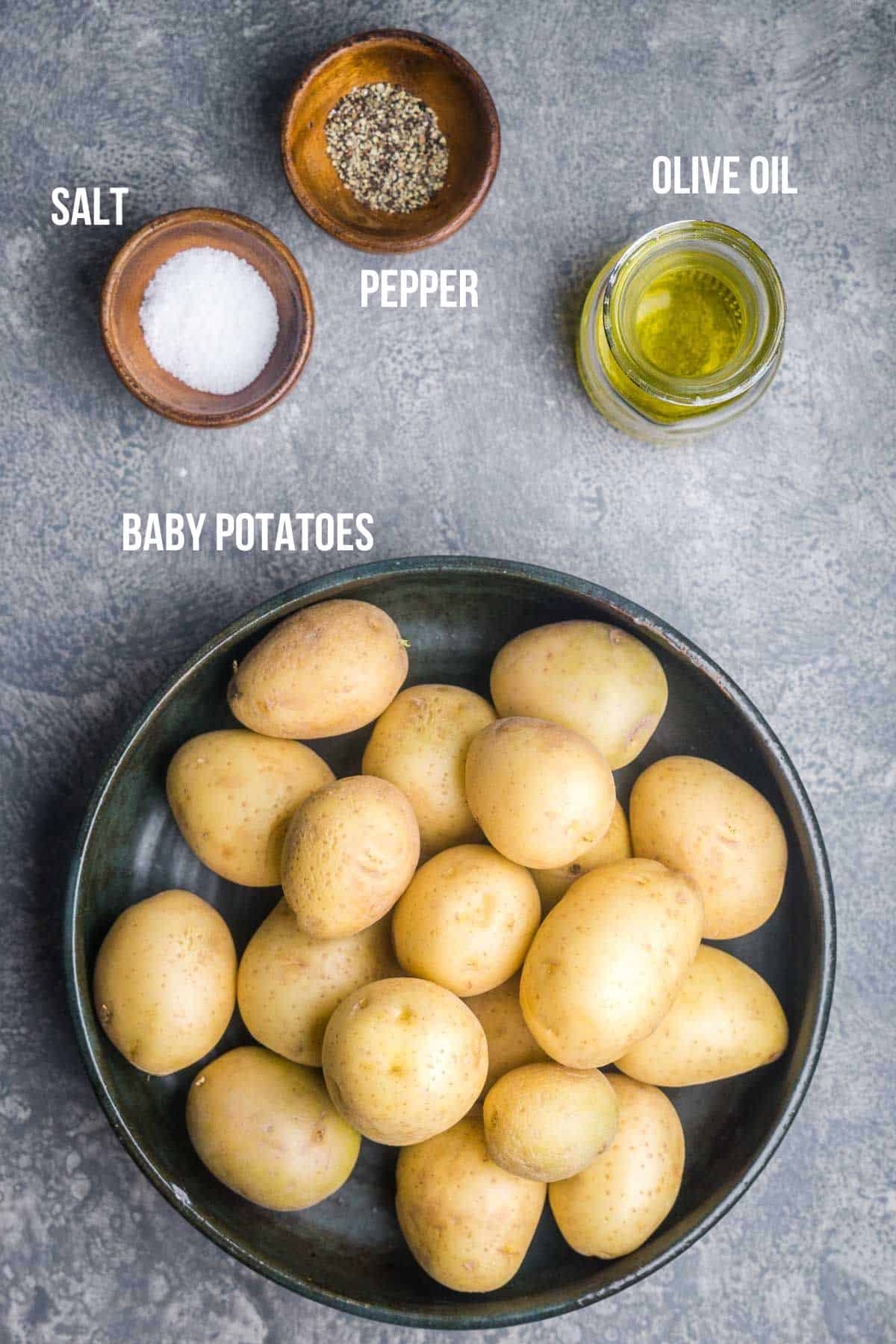 baby potatoes, olive oil, salt, and pepper in bowls labeled