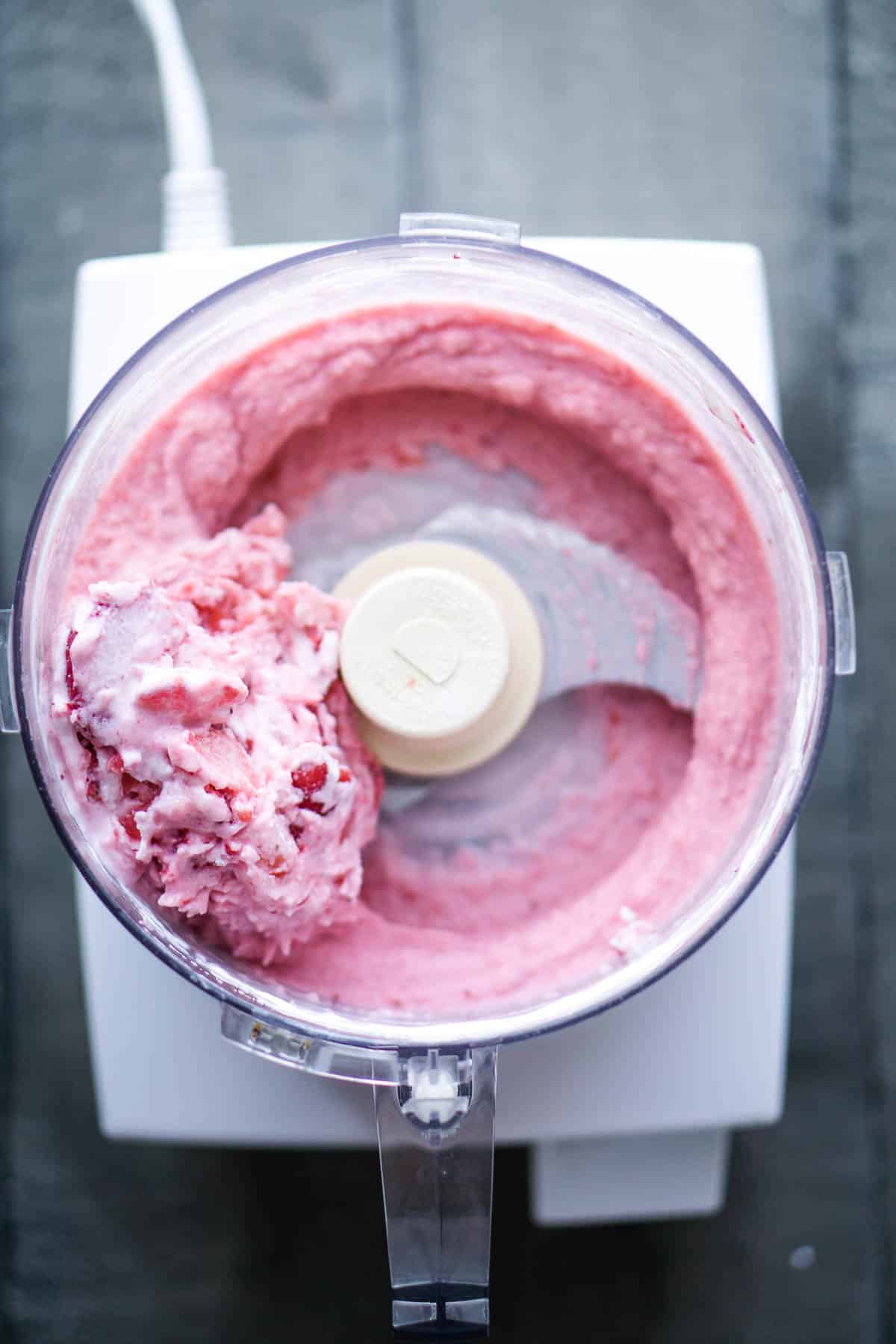 strawberries and yogurt blending in food processor