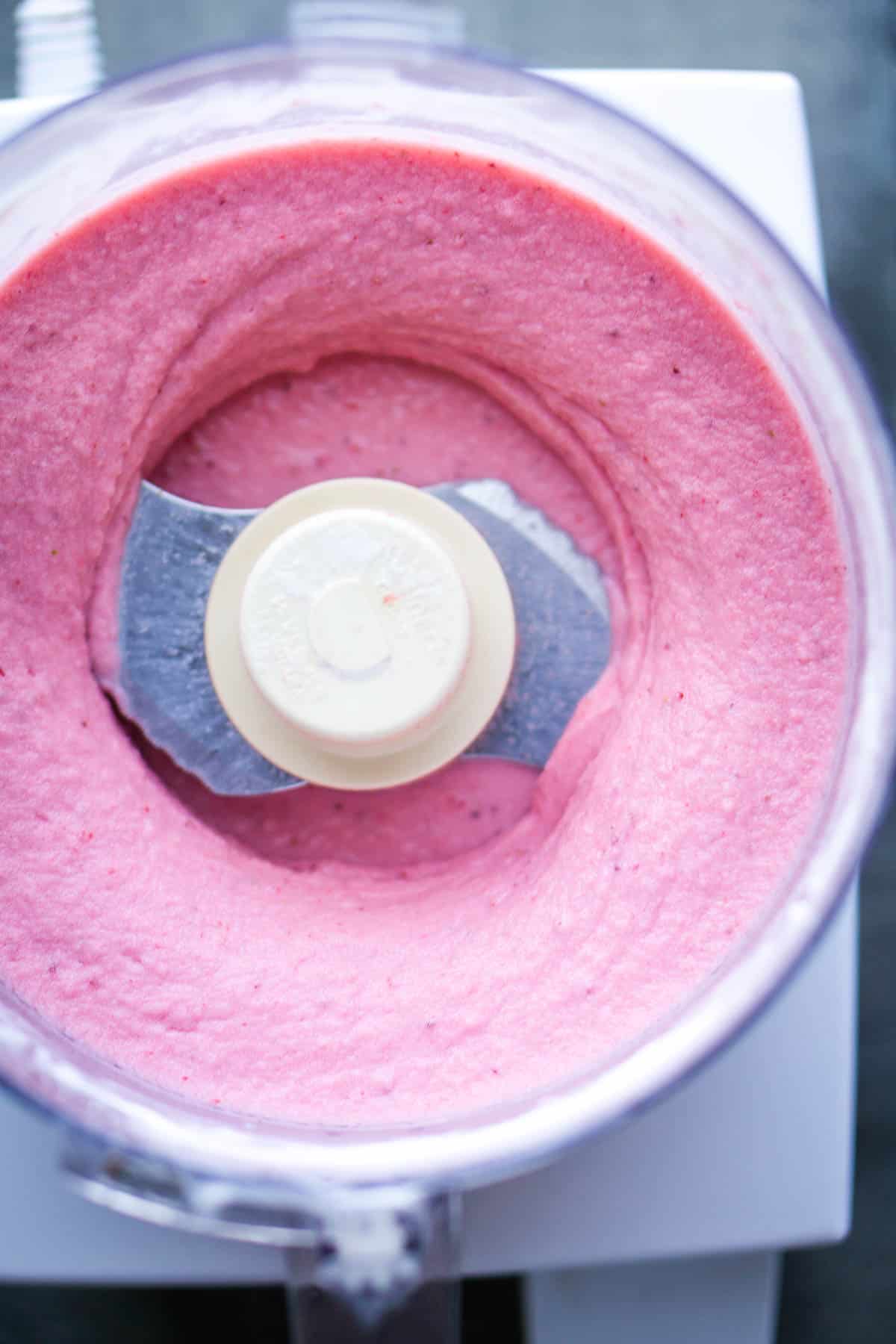 blended strawberry frozen yogurt in food processor