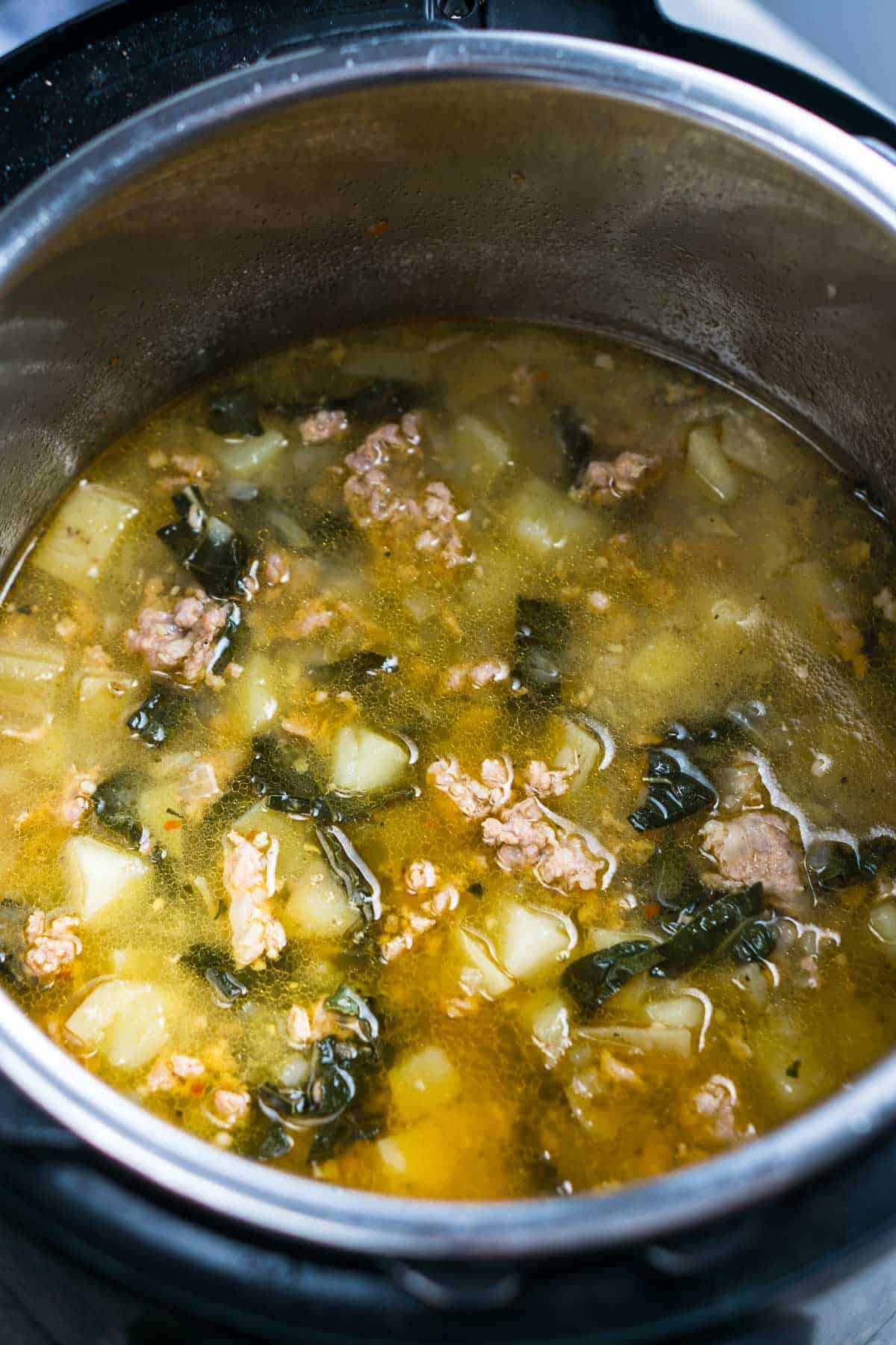 zuppa toscana soup ingredients in pot